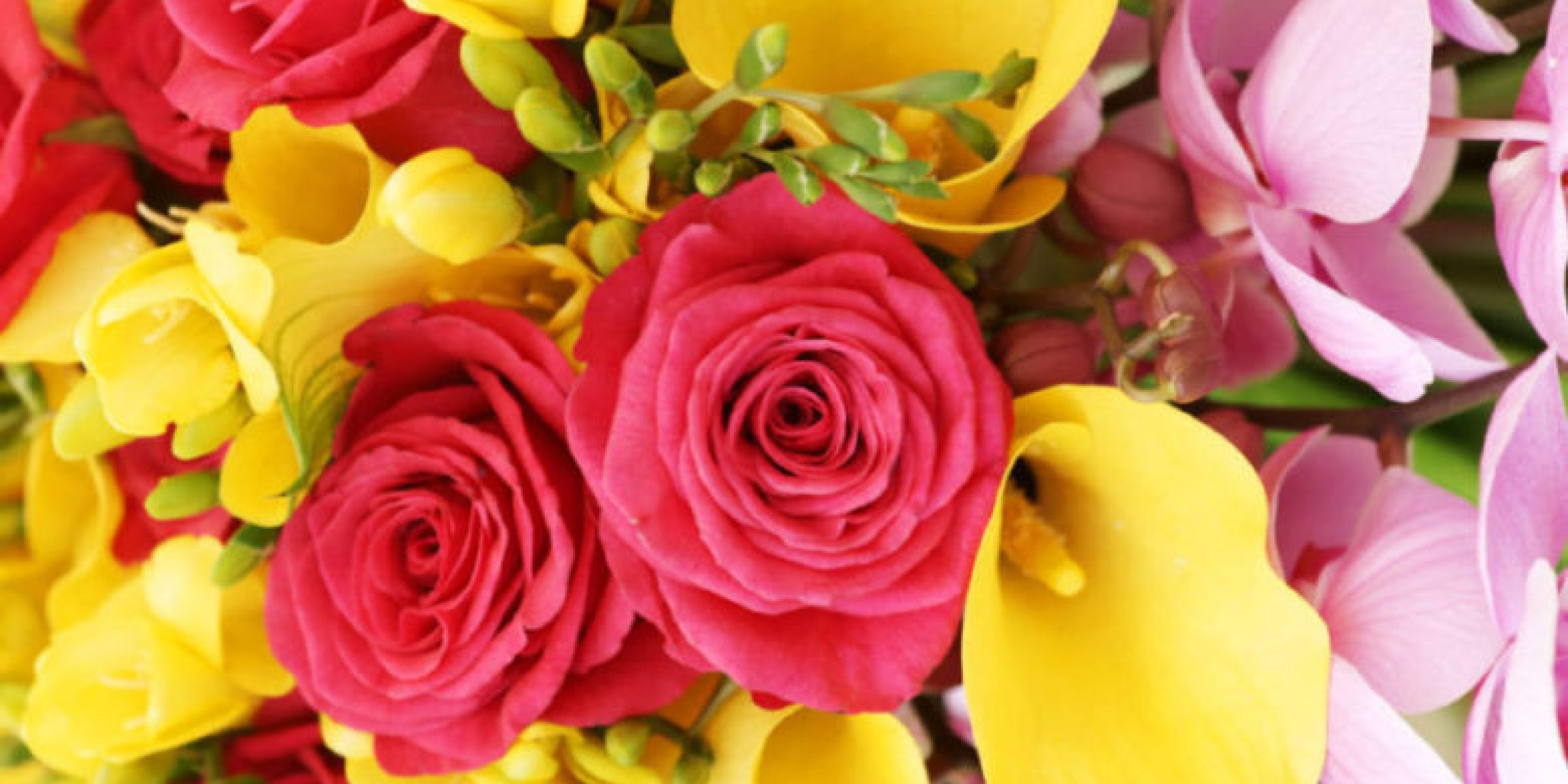 Bouquet close up with roses orchids and calla lilies